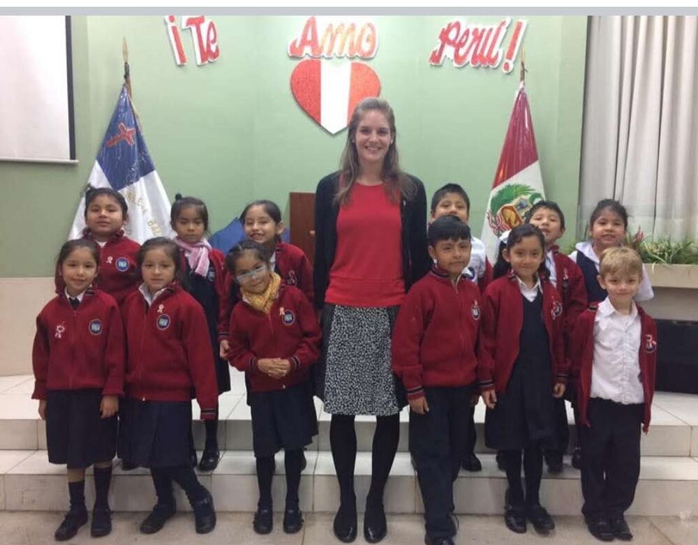 A teacher and her class at Pioneer Christian School