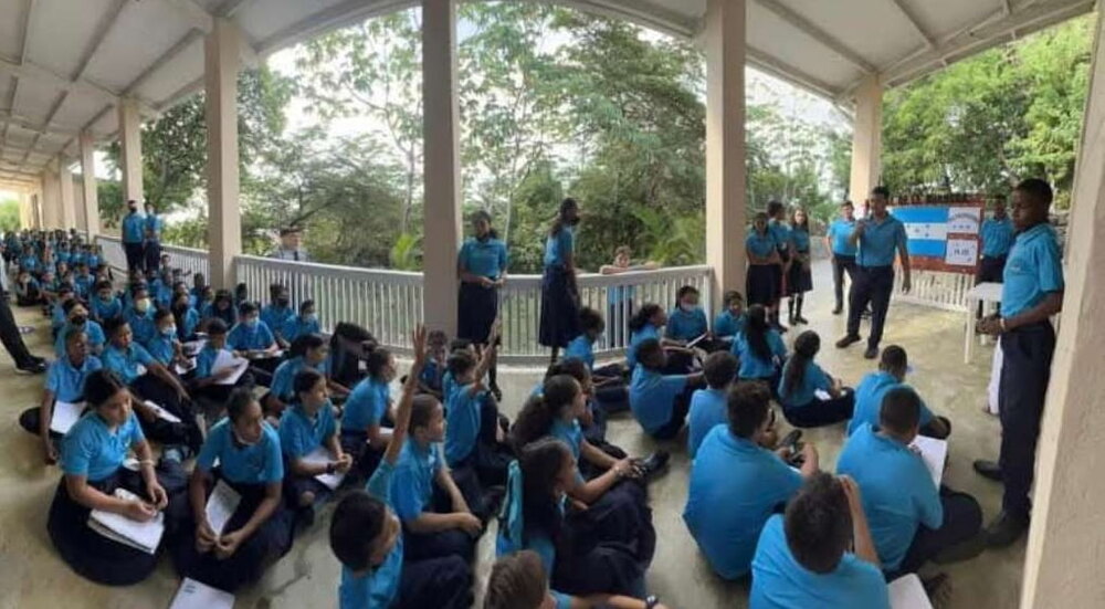 Pupils gathered under the walkway at Solid Rock Education Center